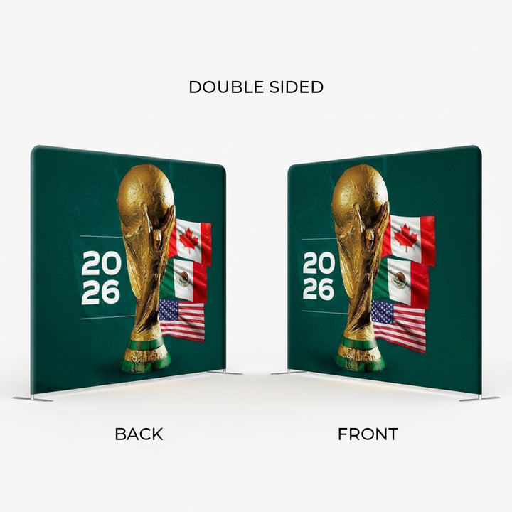 Double-sided display of a golden trophy with flags and '2026' text on a green background.